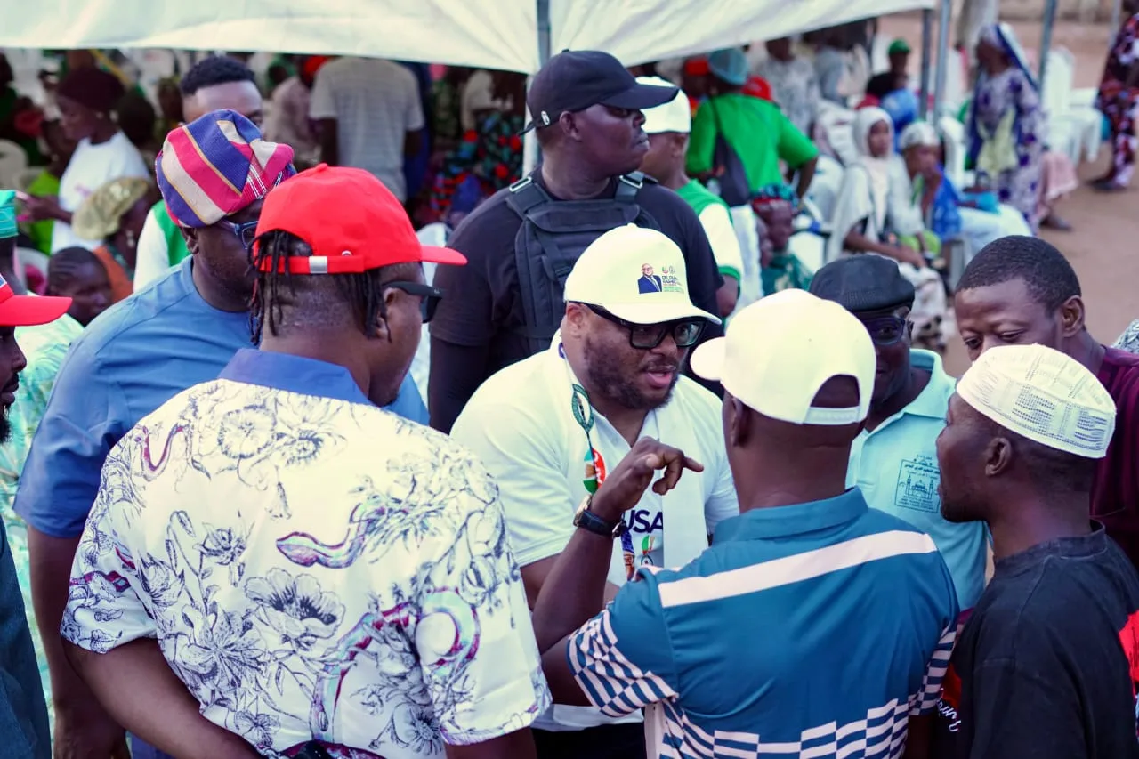 Dr. Rasheed Olayinka Alausa speaking with constituents during a grassroots gathering